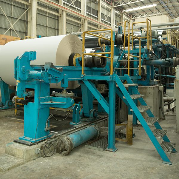 Large white paper reel on a paper-making machine